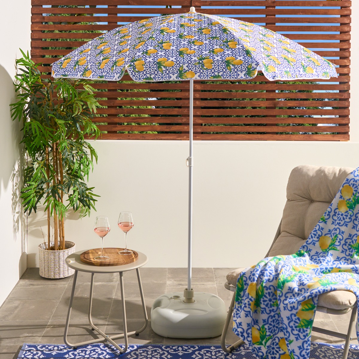 lemon print patio umbrella 9' Market Umbrella, 32” wide when open 23.5 tall (top to handle bottom) Bamboo and synthetic silk Handmade in China Not for use in rain Boho Parasol Umbrella : Lemon